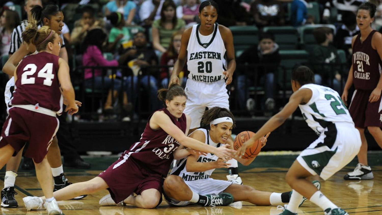 Eastern Michigan and Rochester College players wrestle for the ball Wednesday.