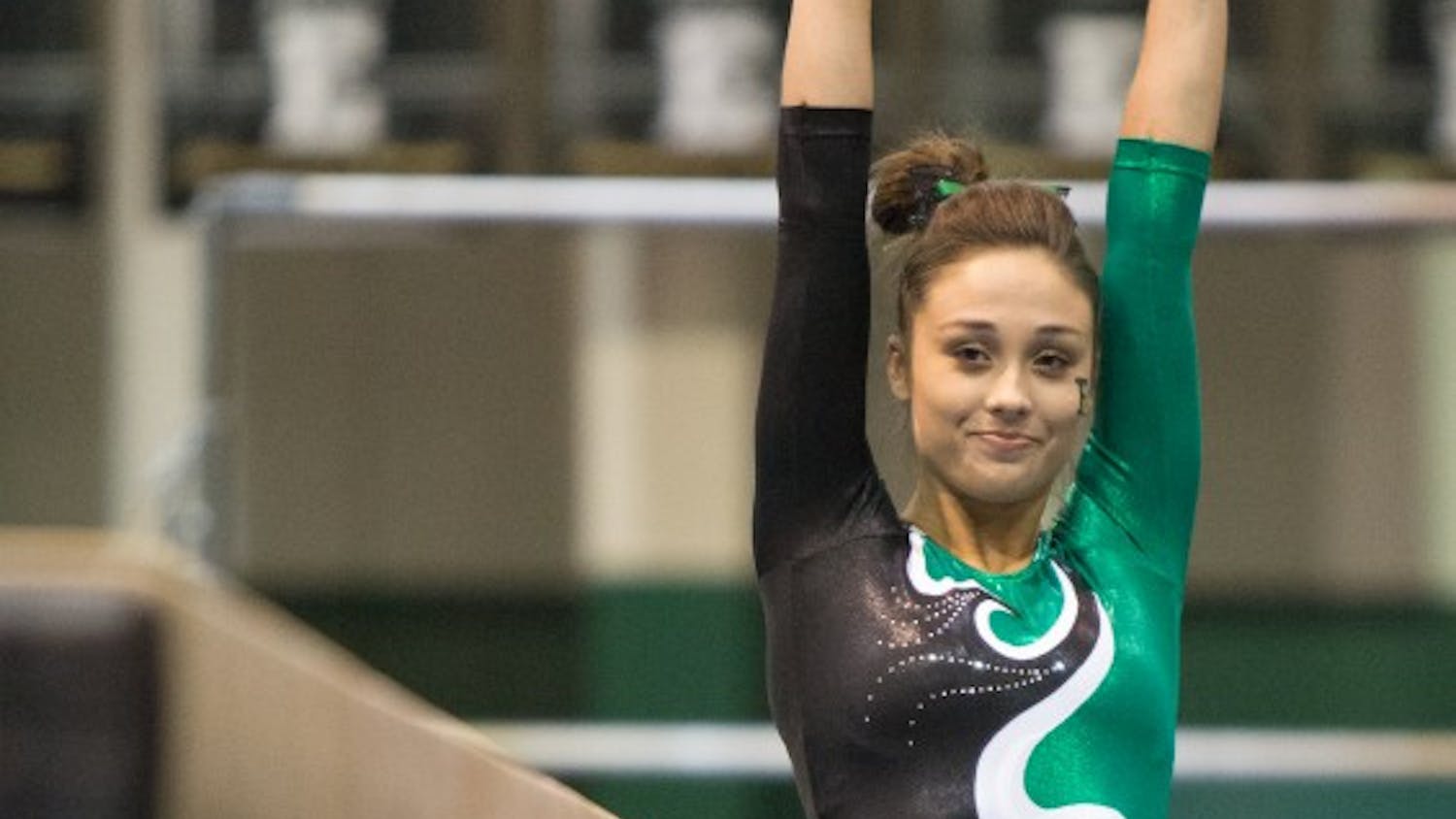 Eastern Michigan freshman Kelsie Brooks gets ready to perform on the beam in the Eagles 195.925-194.600 loss to Central Michigan Friday night.
