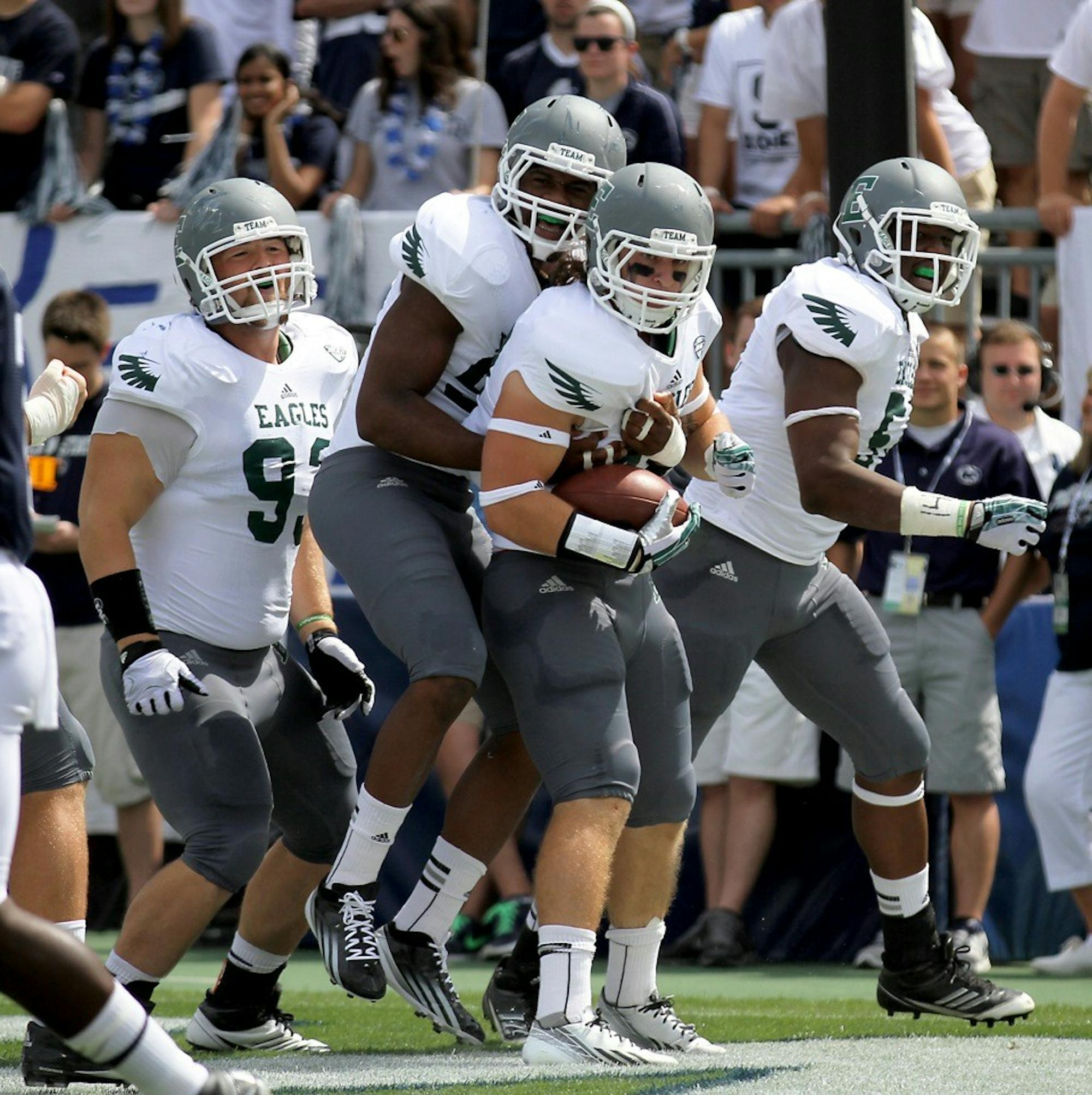 	EMU linebacker Hunter Matt celebrates after returning a fumble for a touchdown in EMU&#8217;s 45-7 loss to Penn State in Happy Valley.