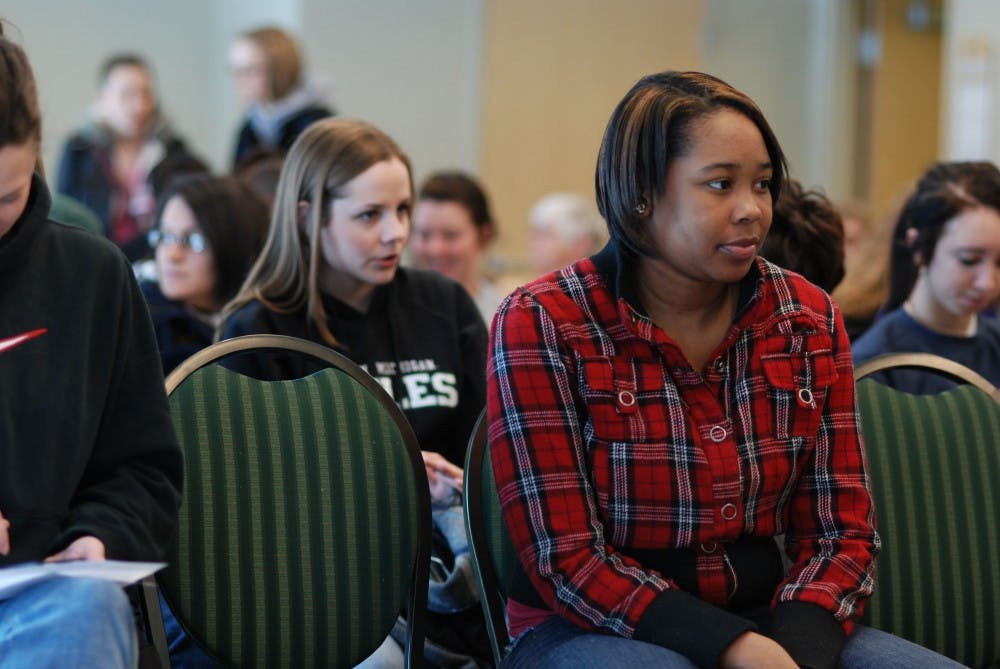 Chelsea Wilson, an Eastern Michigan University undergraduate student, attending the Women in Faith discussion Tuesday in the Student Center. Her Introduction to Women's Studies instructor, Jessica Kilbourn, was one of the speakers.