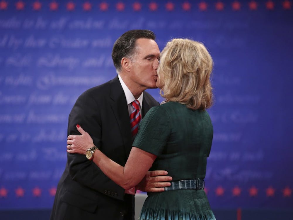 Republican presidential nominee Mitt Romney kisses his wife Ann at the end of the third presidential debate at Lynn University in Boca Raton, Florida on Monday, October 22, 2012. (Richard Graulich/Palm Beach Post/MCT)