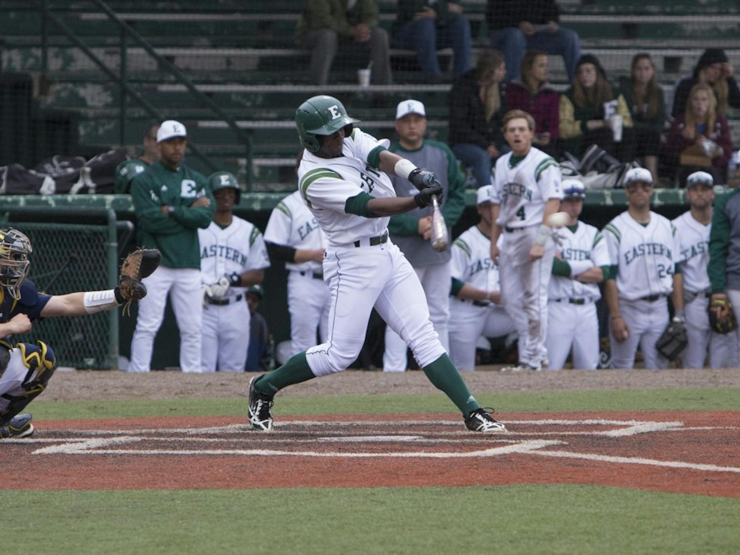 EMU left fielder Dae Bowden provides 1 of Eastern’s 13 hits tuesday night in their 15-10 victory over Michigan.