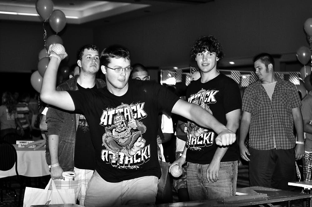 New students play a game in the Student Center ballroom during last Sunday’s Eaglepalooza, in which they had to knock over bottles to win prizes. Eaglepalooza is a part of the larger efforts of Fusion, which acquaints freshmen with EMU’s campus and with college life in general.