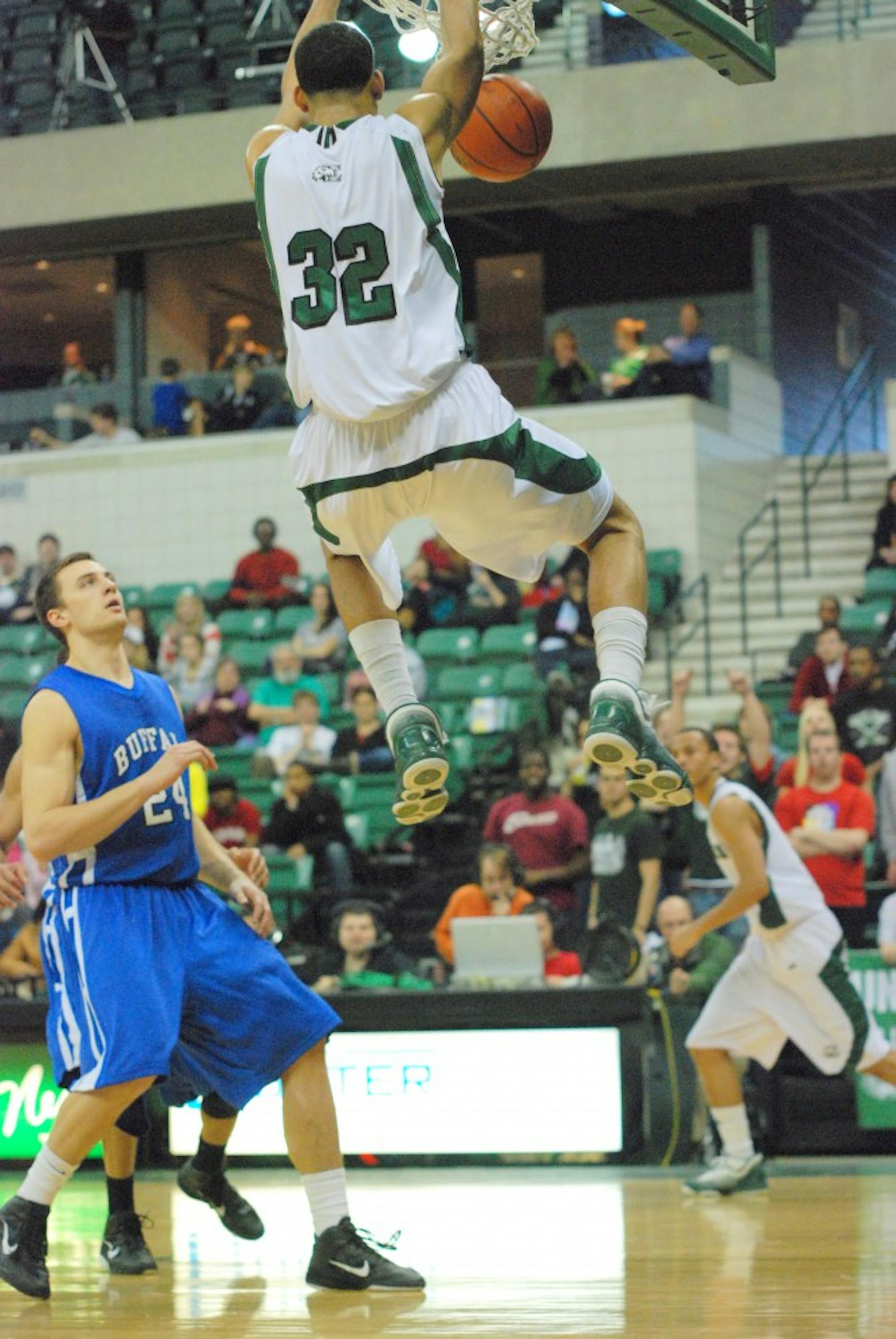 	Sophomore Jamell Harris dunks the ball during Saturday night’s winning game against Buffalo.