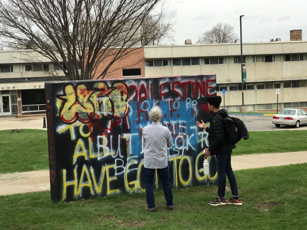 Christine Ridgway and Travis Howell Paint over Controversial Message on Nipsey Hussle Tribute