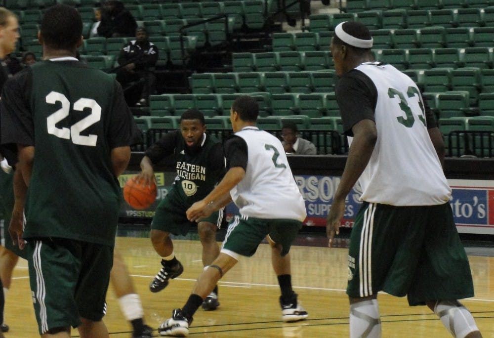 EMU men's basketball green and white