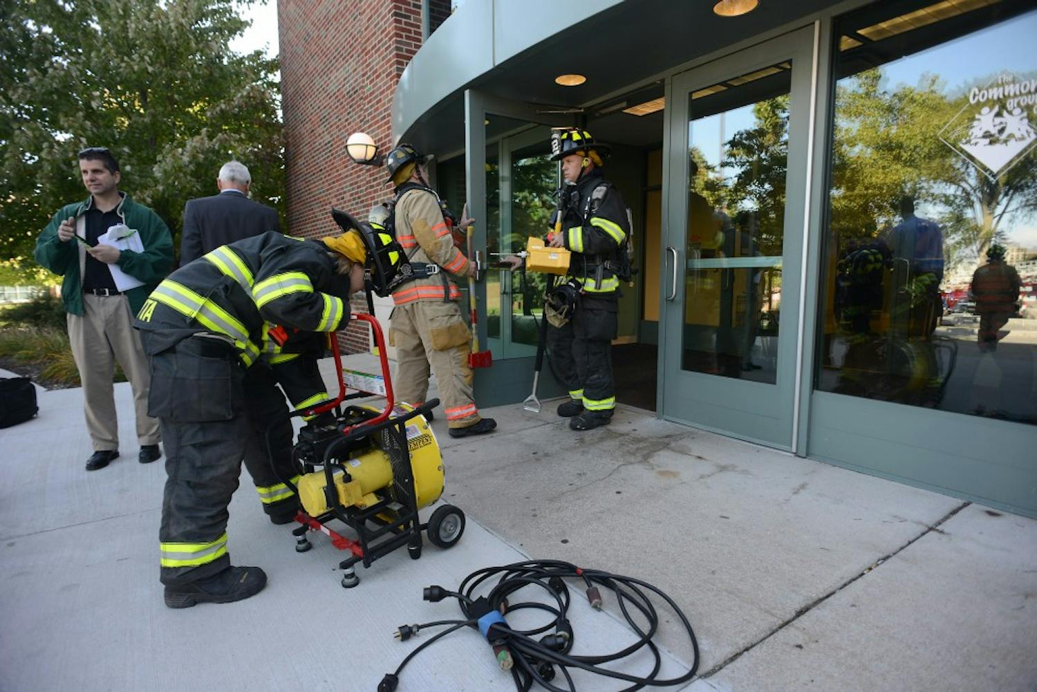 The Ypsilanti Fire Department working to remedy the generator malfunction at Marshall Building Wednesday morning.