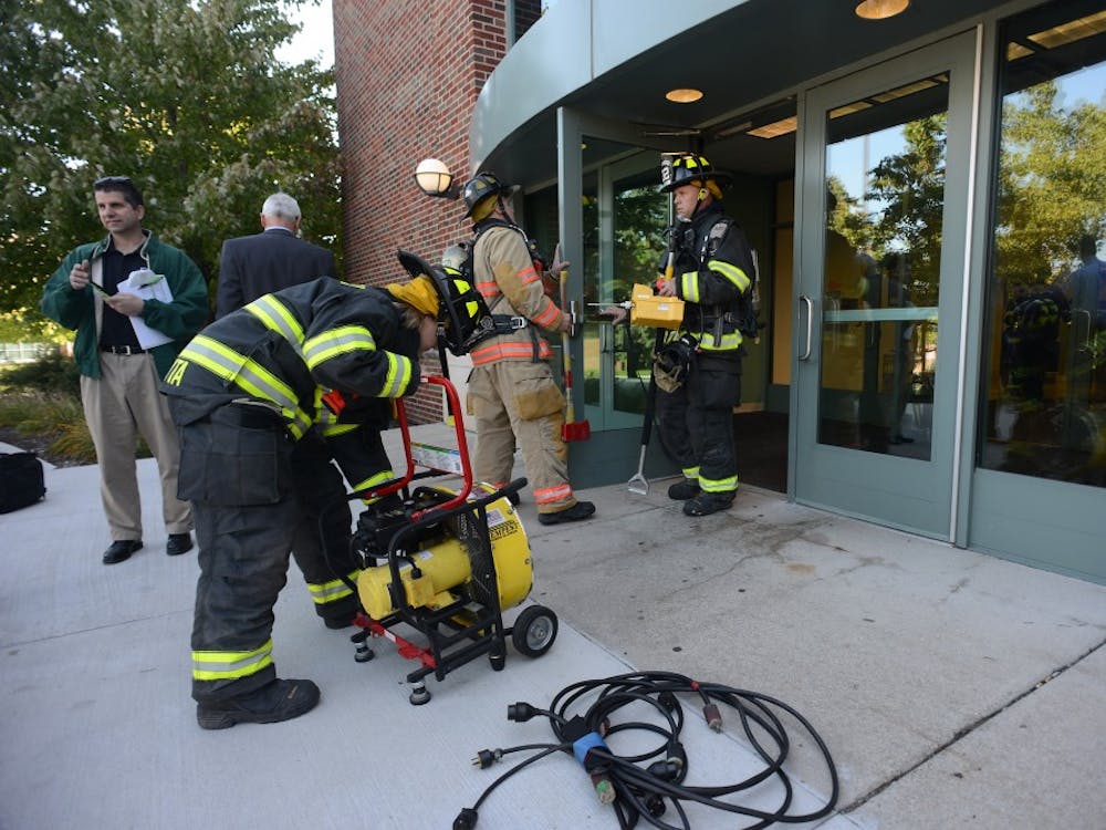 The Ypsilanti Fire Department working to remedy the generator malfunction at Marshall Building Wednesday morning.