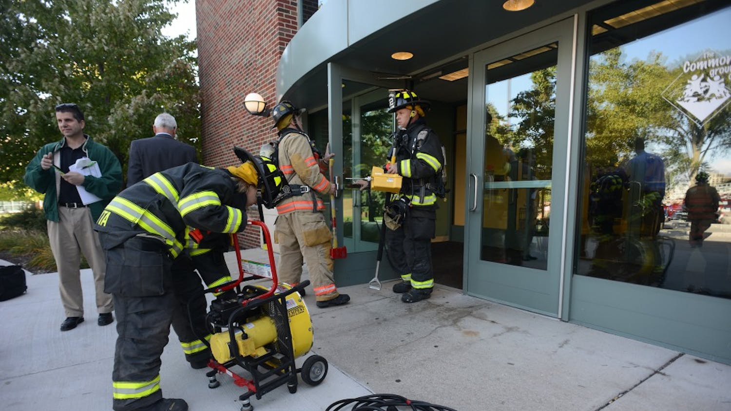The Ypsilanti Fire Department working to remedy the generator malfunction at Marshall Building Wednesday morning.