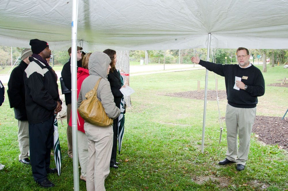 	Lewis Savage, Assistant Director for University Apartments, gives a brief history of the fitness trail area and outlines future plans.