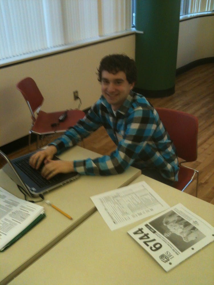 	Andrew Walla works to help students with taxes.
