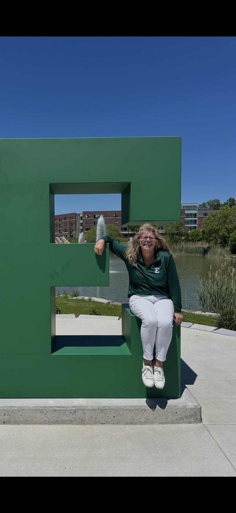Meg Castro sits on the block E on campus. 