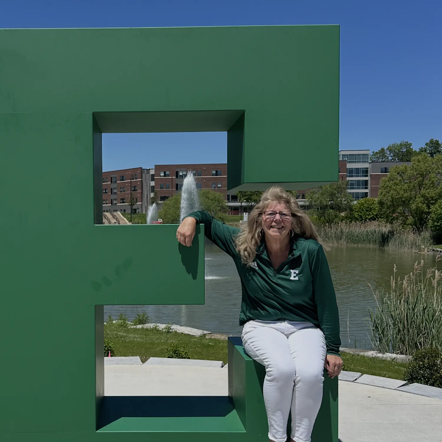 Meg Castro sits on the block E on campus.