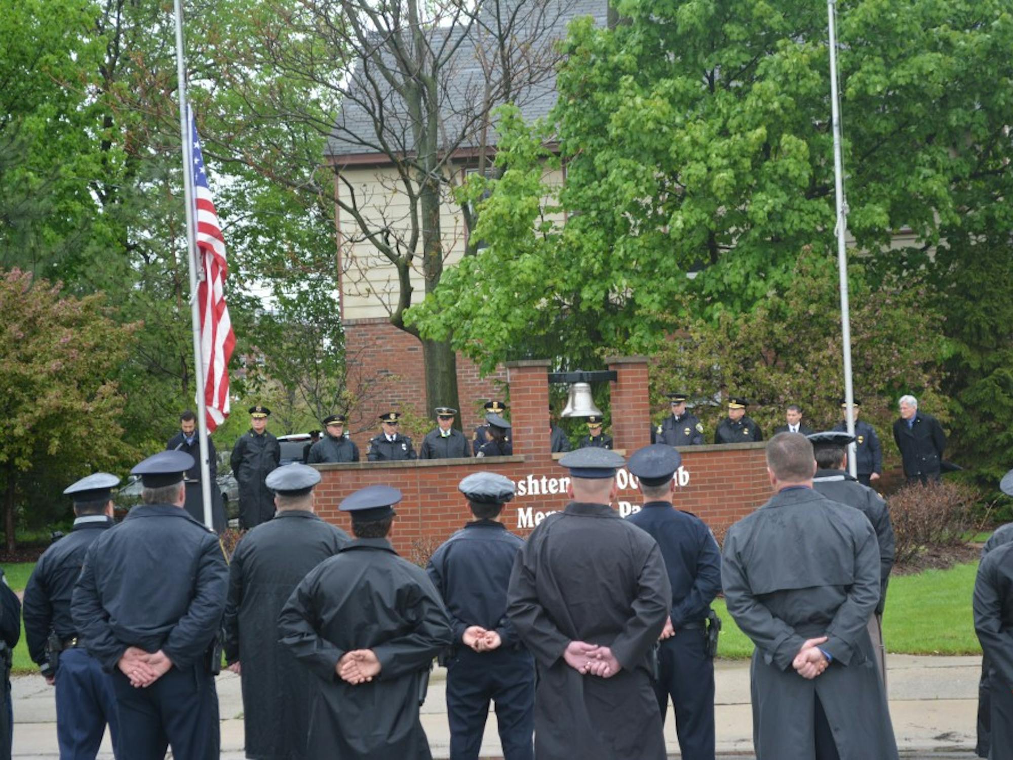 	Washtenaw County police officers honoring those lost in the line of duty at Memorial Park.