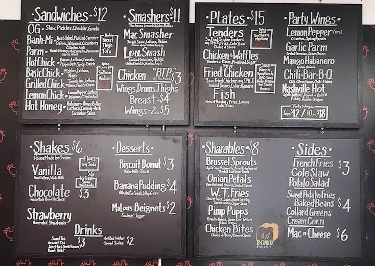 Ma Lou's wall menu with white text on a blackboard. 