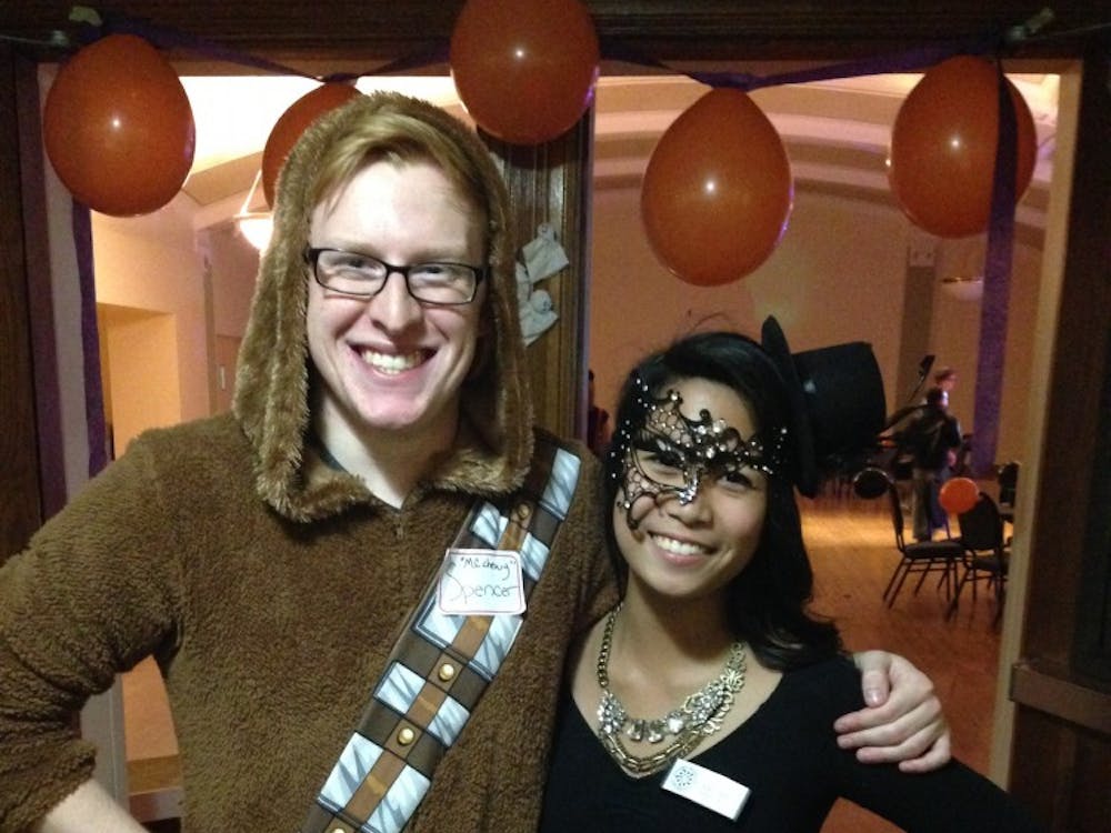 Spencer Mattinson, disc jockey at the event, dressed as Chewbacca with Adrienne Cruz, founder and president of Pencils of Promise at EMU, dressed as Mystery.