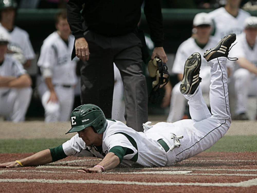 CF Bo Kinder (2), slides into homeplate head first to give the Eagles their first run of the game against Toledo on Sunday, May 16. The Rockets defeated Eastern Michigan 7-3.