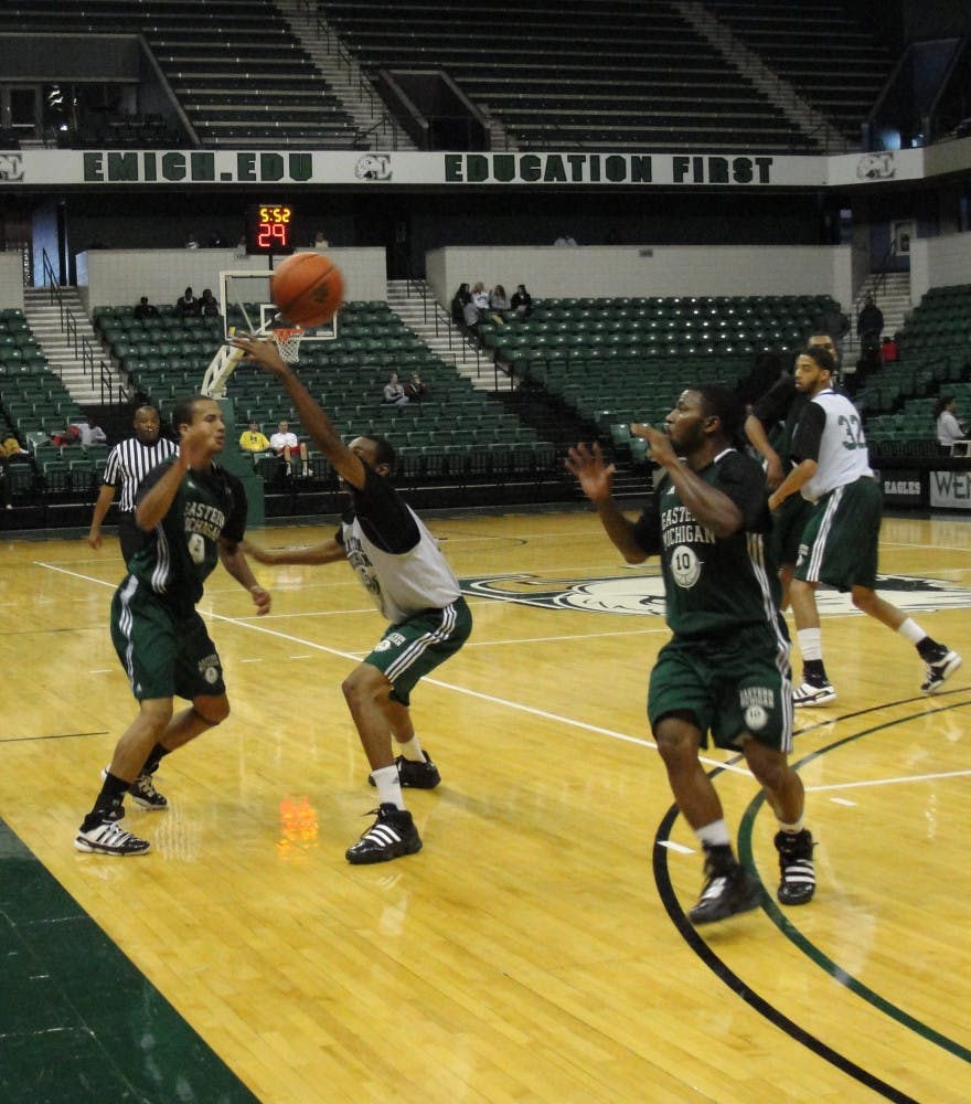 EMU men's basketball green and white