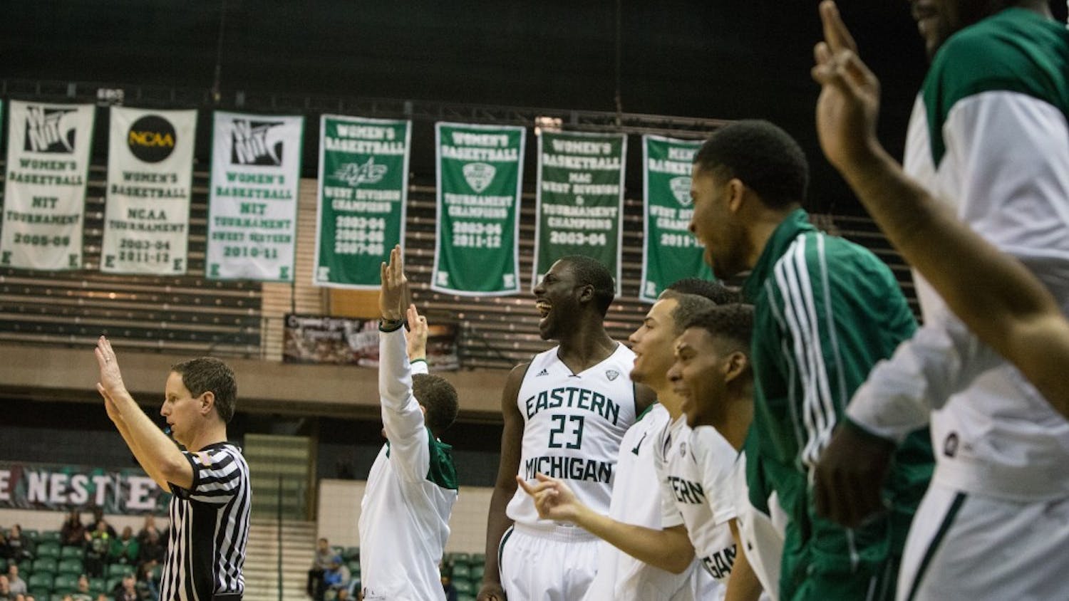 The Eastern Michigan bench reacts after Karrington Ward hits one of his six three pointers in the Eagles 72-60 win over Central Michigan University in the first round of the MAC tournament Monday night.