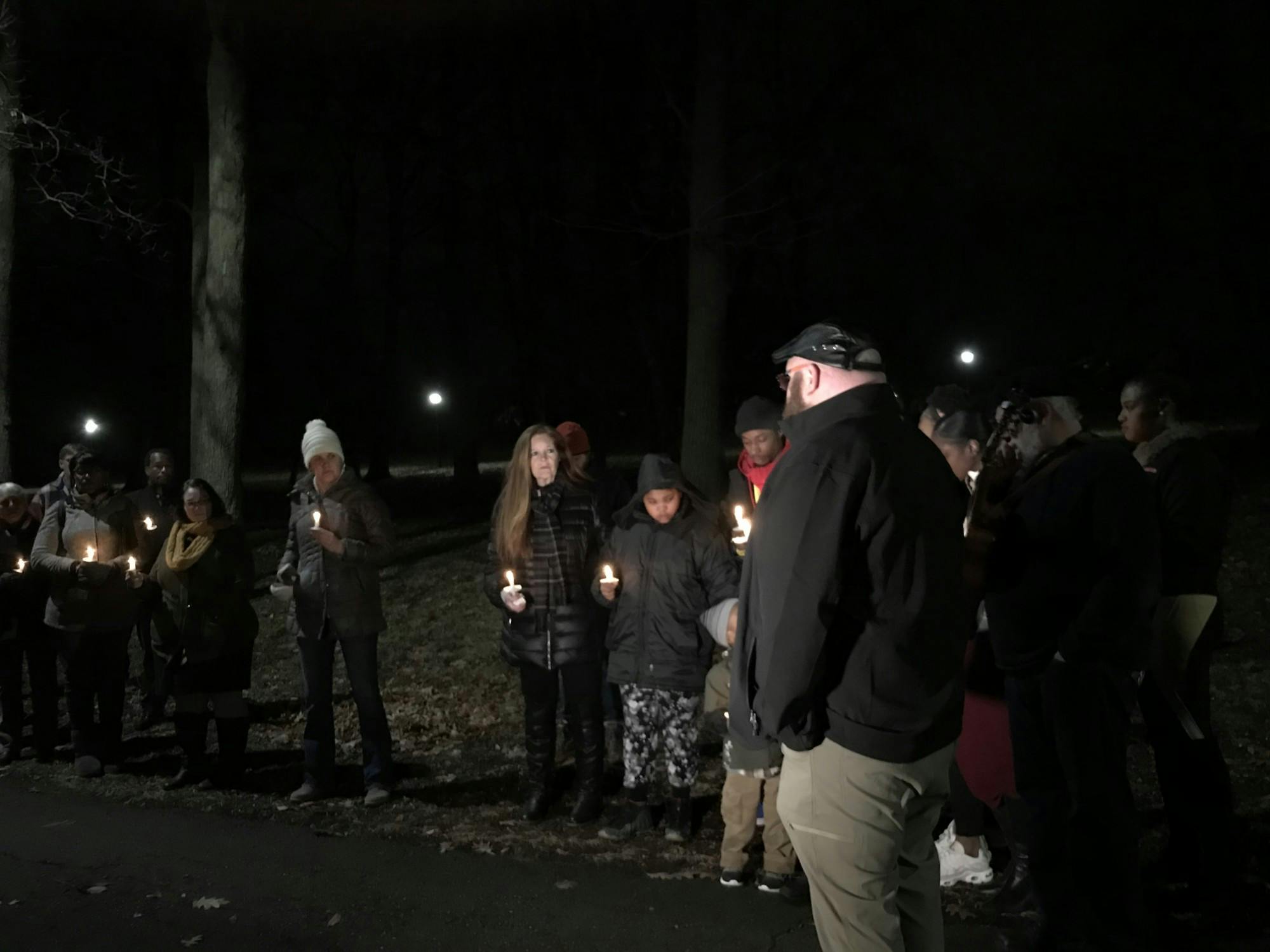 Pastor Mike Desotell leads a vigil at Nancy Park for slain 21 year old man