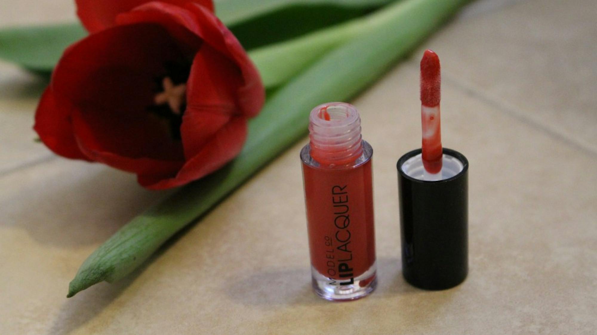 Try brighter lip colors, like this Lip Lacquer lipgloss by ModelCo.