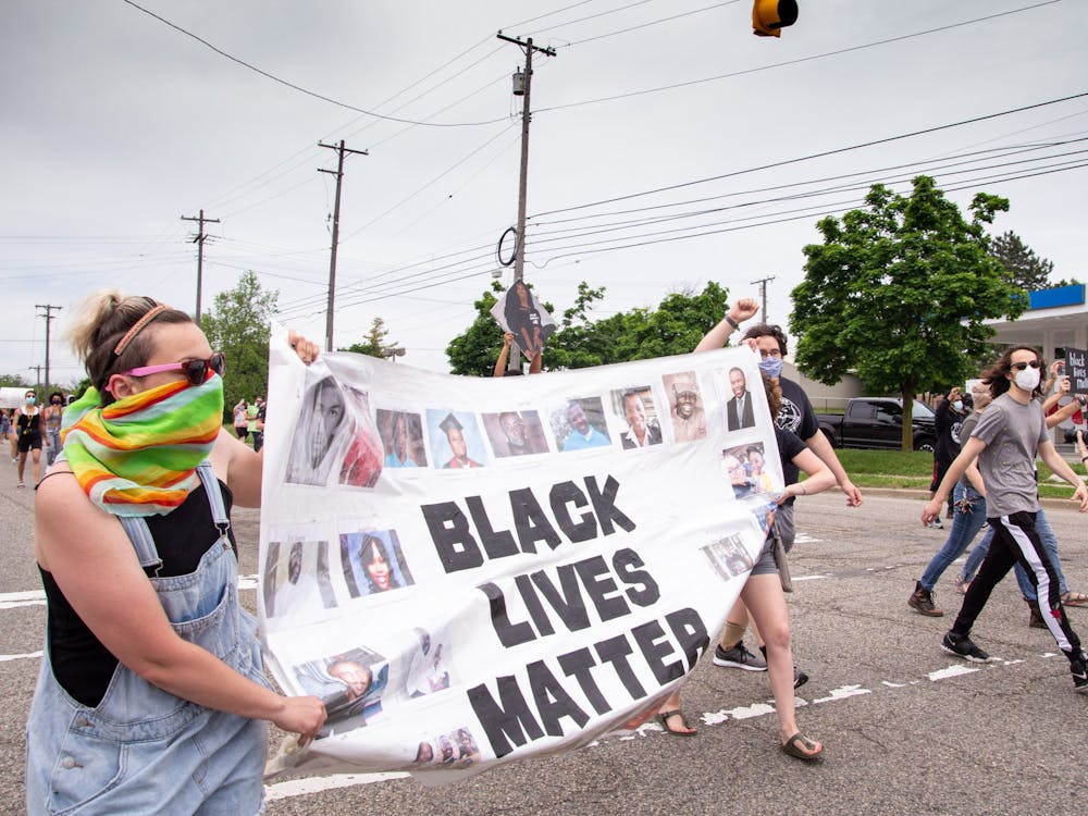 Protesters block the intersection of Hogback Rd., Capenter Rd. and Washtenaw Ave. (continued)