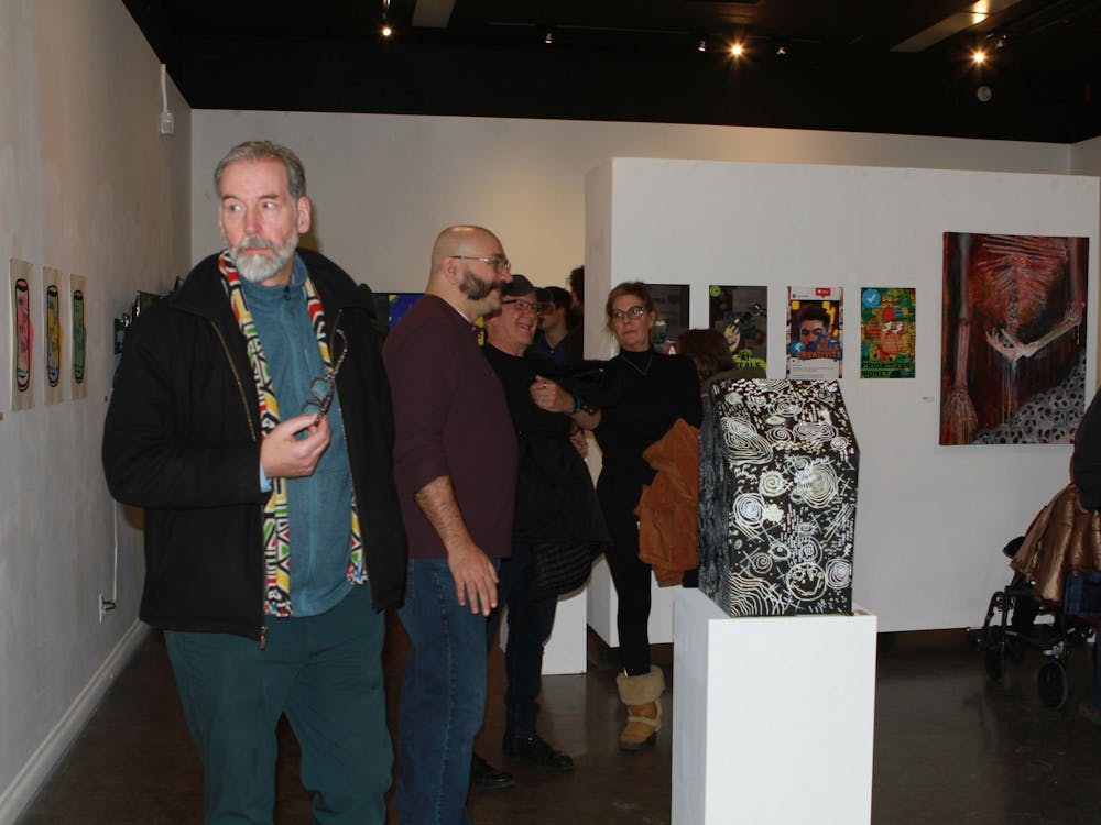 The EMU community gathers to support the senior capstone exhibition, UNITY, during the reception held on Dec. 4. UNITY, located in the Ford Gallery, is on display until Dec. 22.