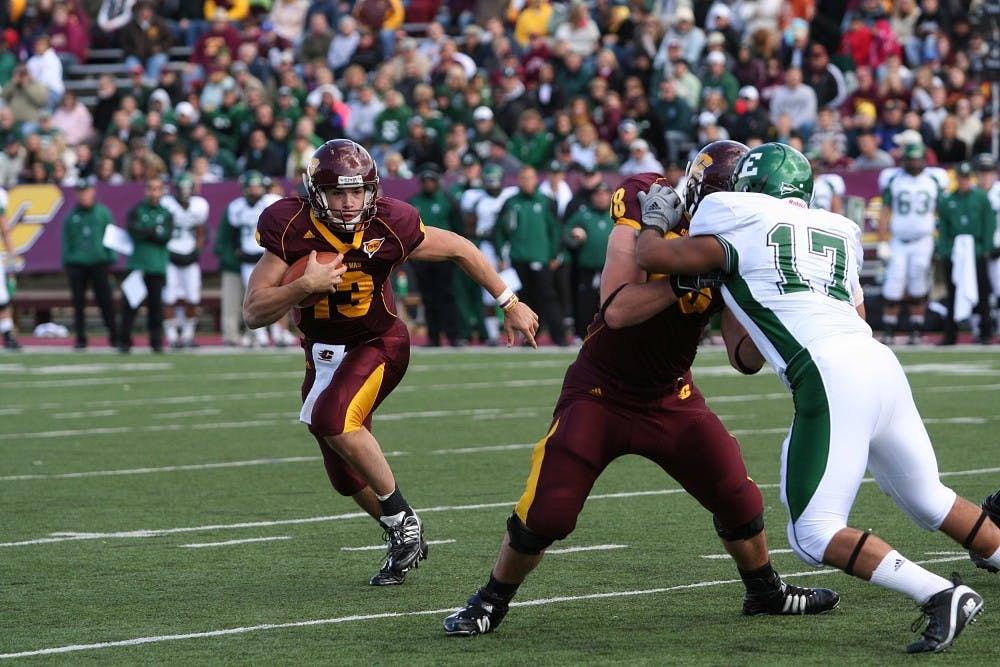 Dan LeFevour (13) in Central Michigan’s 56-8 win over Eastern Michigan on Saturday. He tied a career high with six touchdowns (3 passing, 3 rushing).