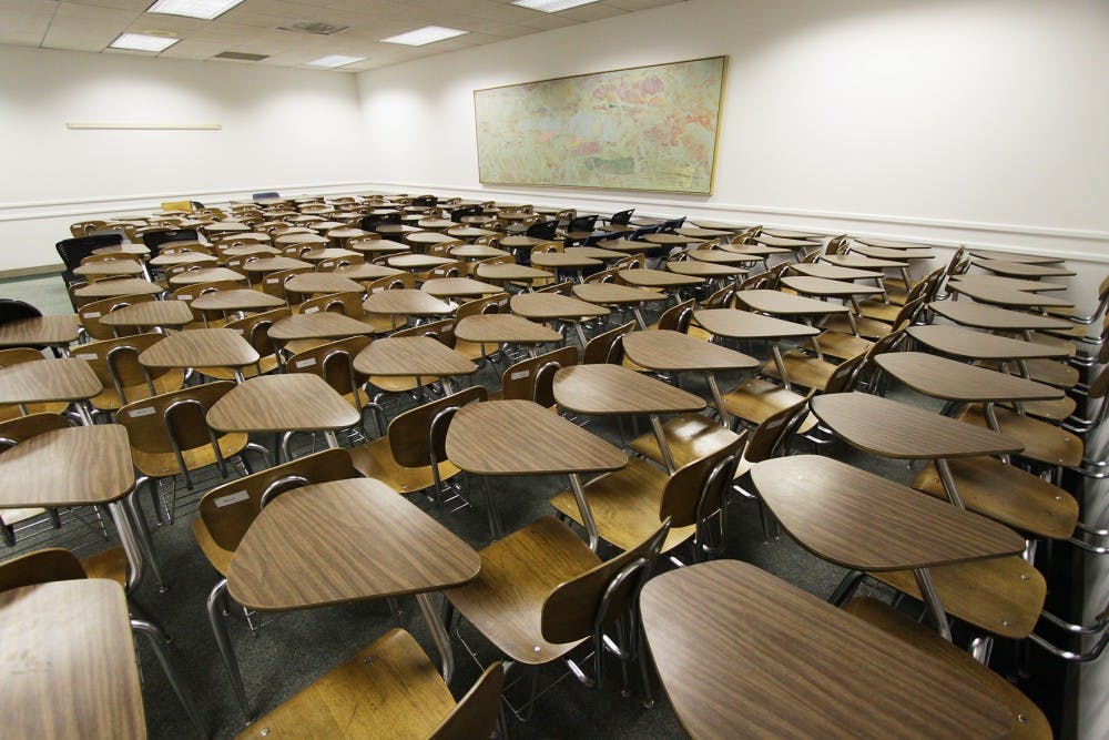 Workers at the Morse Moving and Storage company move desks into McKenny Hall, which will open its doors after receiving about $1 million in work.