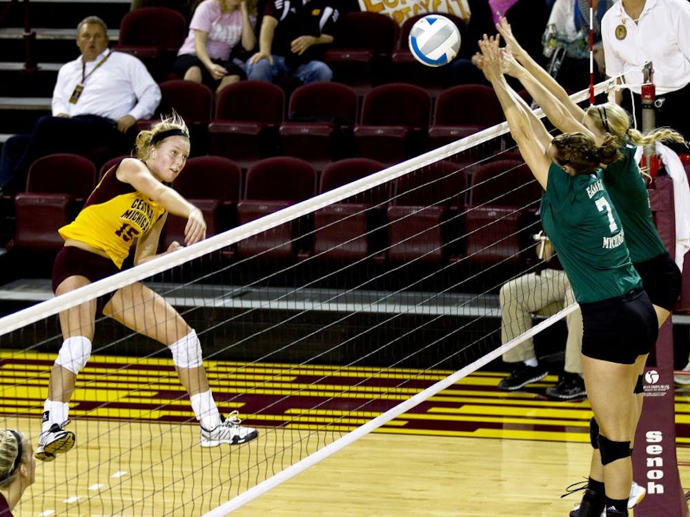 Chuck Miller/Staff Photographer

Sophomore outside hitter Kaitlyn McIntyre spikes the ball at the Eastern Michigan defense Thursday night at McGuirk Arena.  The Chippewas won the match sweeping the Eagles three sets to none. 