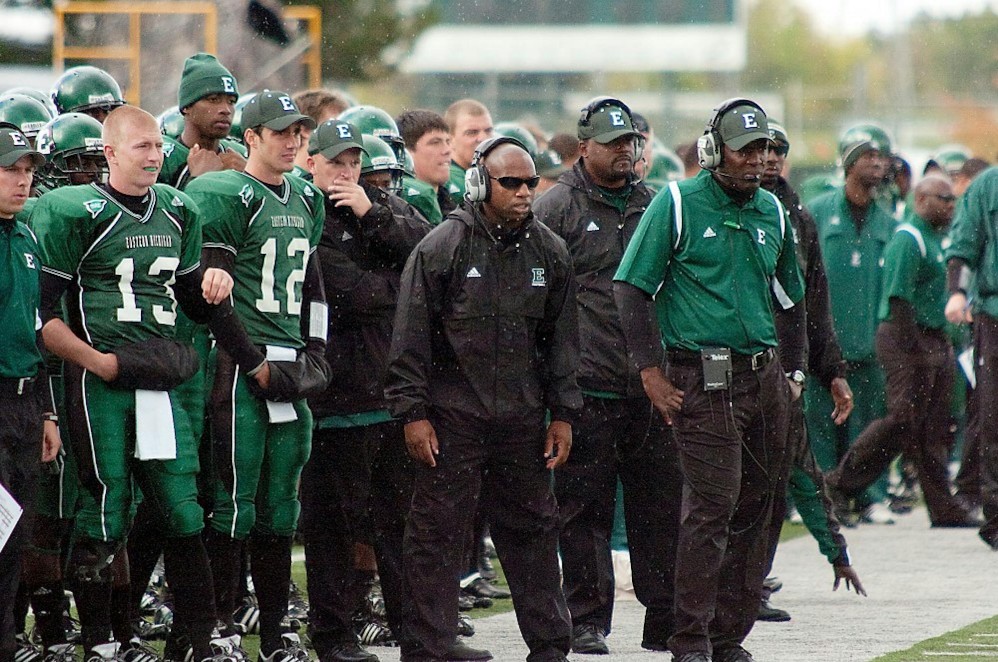 Ron English (far right) looks from the sideline in EMU’s loss Saturday. His defense allowed 365 yards.