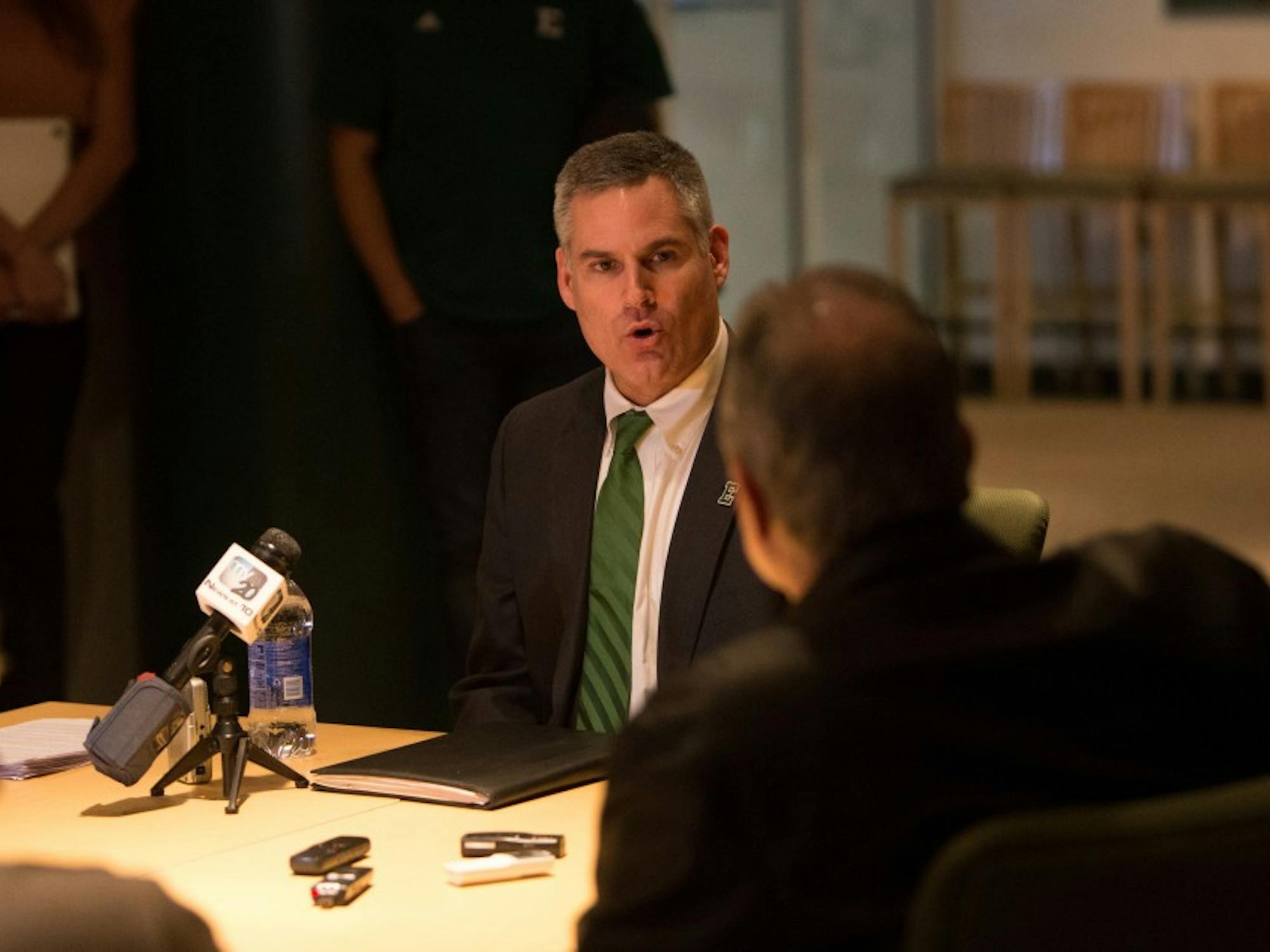 	New head football coach Chris Creighton speaks privately with the media after his press conference Thursday afternoon in the Convocation Center.