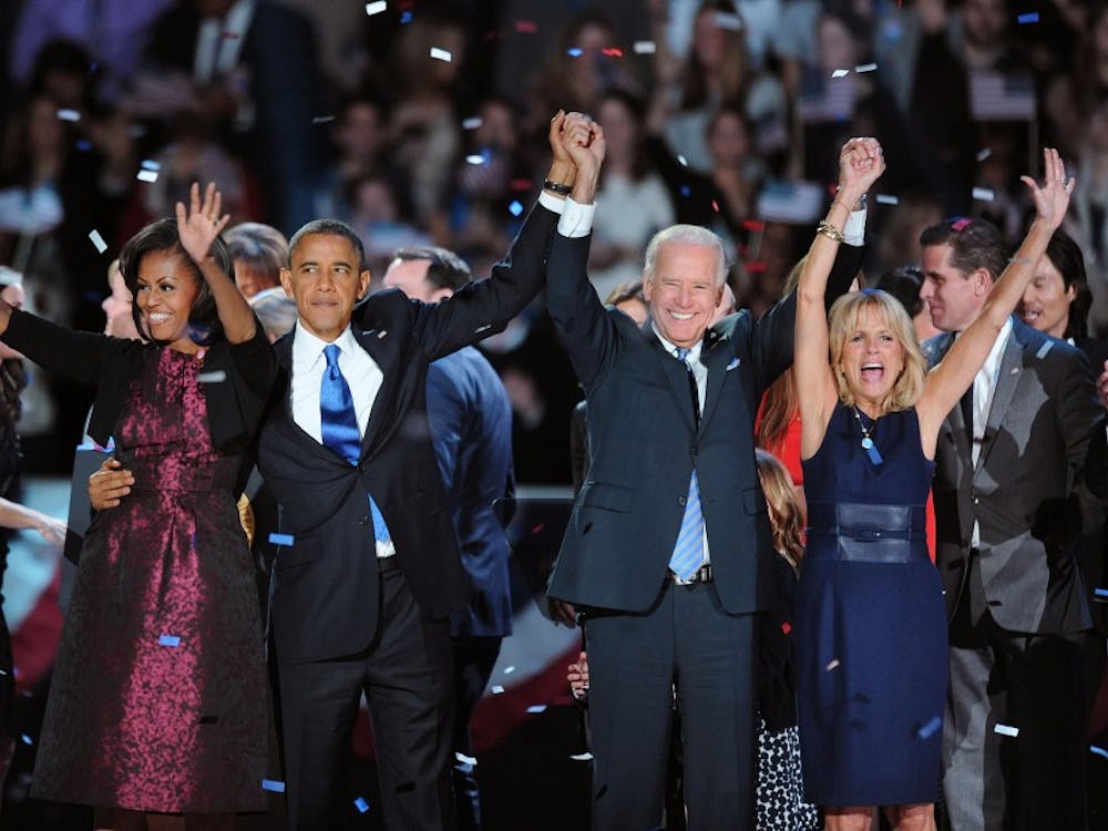 U.S. President Barack Obama, first lady Michelle Obama, Vice President Joe Biden and Jill Biden wave Tuesday, November 6, 2012, in Chicago, Illinois, after the president was re-elected. (Olivier Douliery/Abaca Press/MCT)