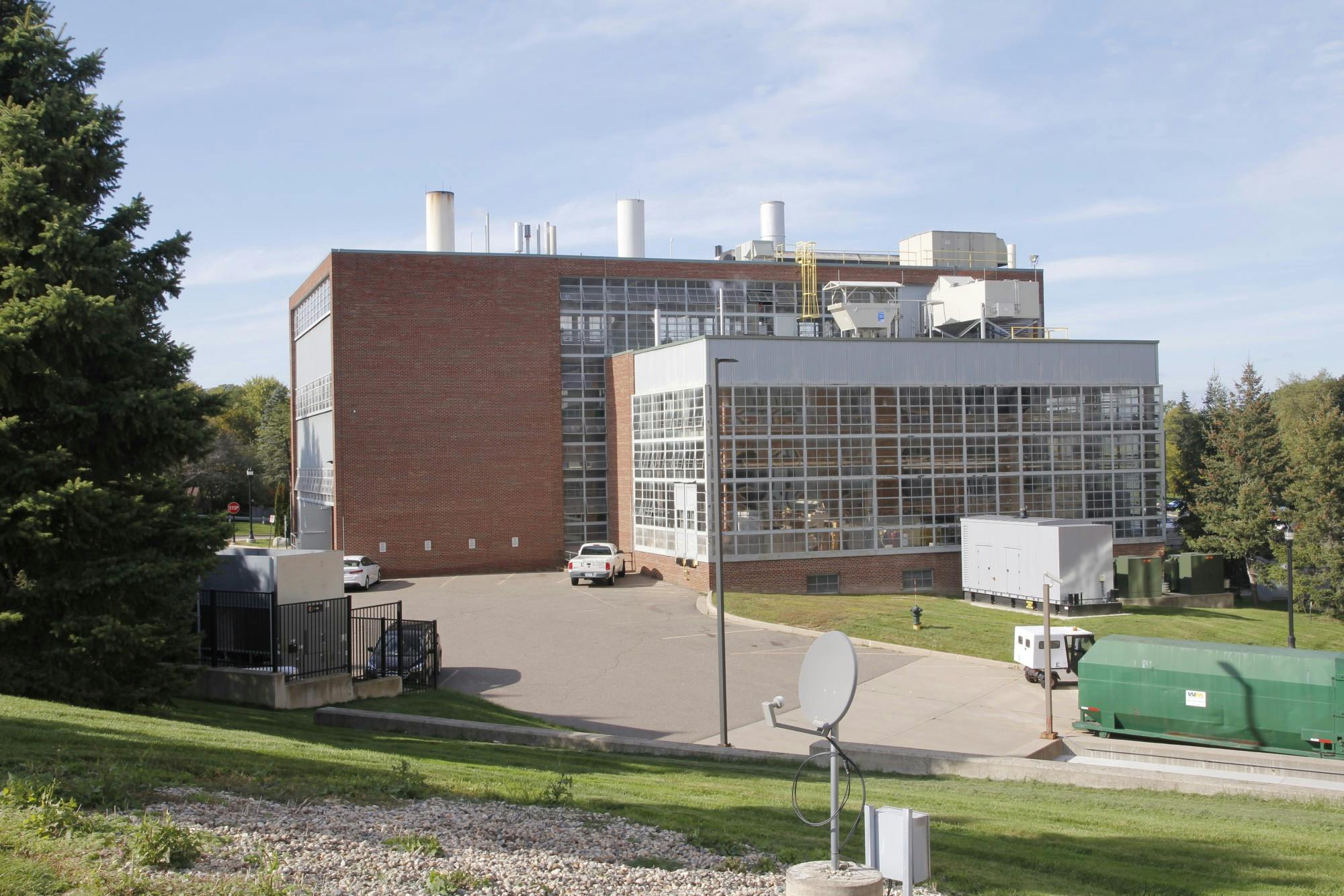 An image of the EMU Energy Center, a brick building with many windows. It is a sunny day.