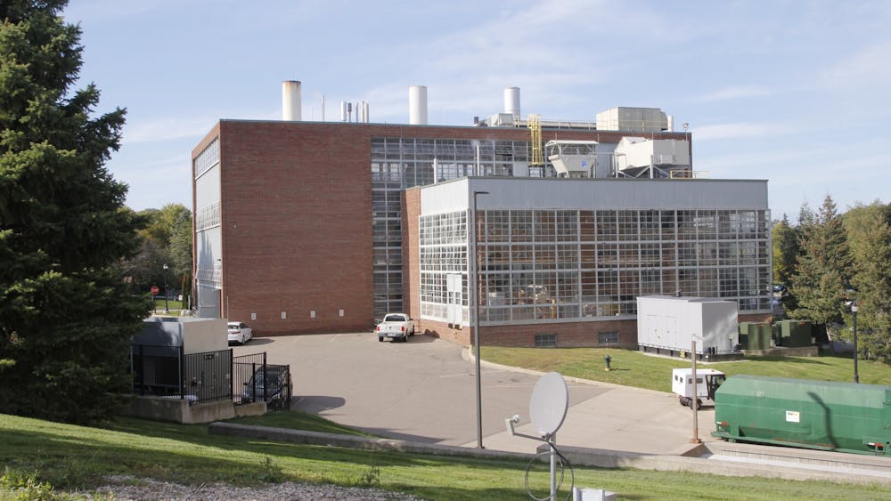 An image of the EMU Energy Center, a brick building with many windows. It is a sunny day.