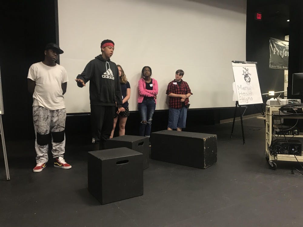 Students discuss solutions for problems in the community