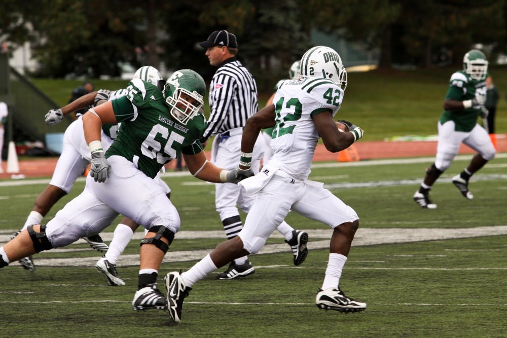 	Dan DeMaster (65) chases after Steven Jackson on a 21-yard interception on a pass from sophomore quarterback Alex Gillett who was 15-of-33 passing for 208 yards including a touchdown. The Bobcats won, 30-17 pulling away from a 10-10 halftime tie. The Eagles are off to a rocky 0-5 start for the season. 