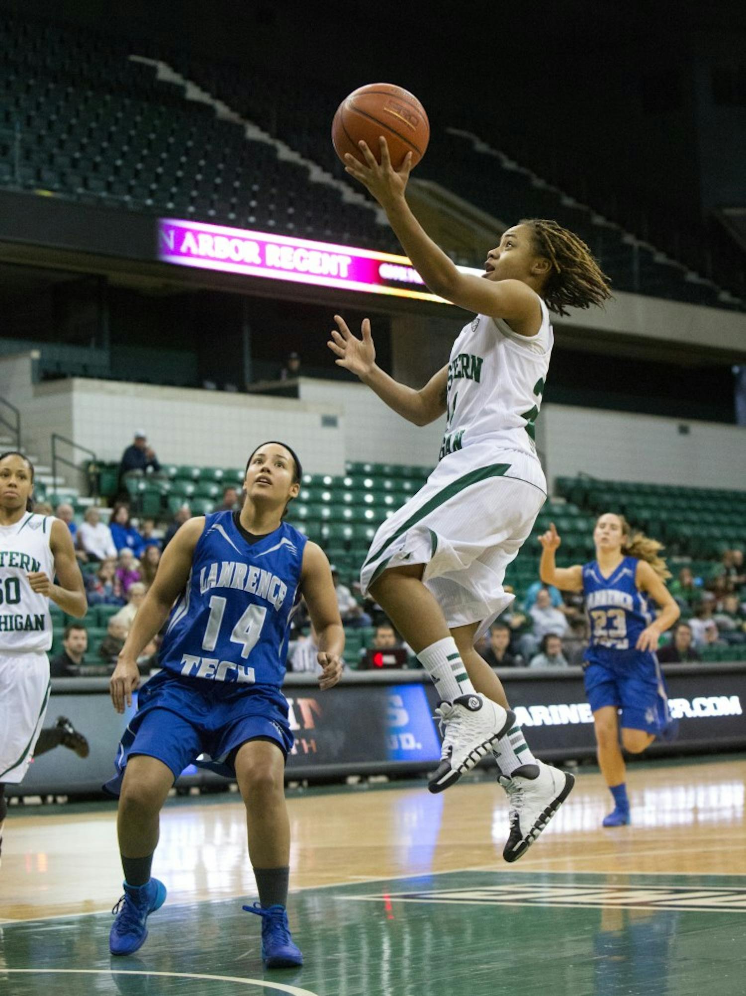 EMU guard Cha Sweeney (24)  drives to the hoop against Lawrence Tech Tuesday afternoon. Sweeney finished with 21 points.