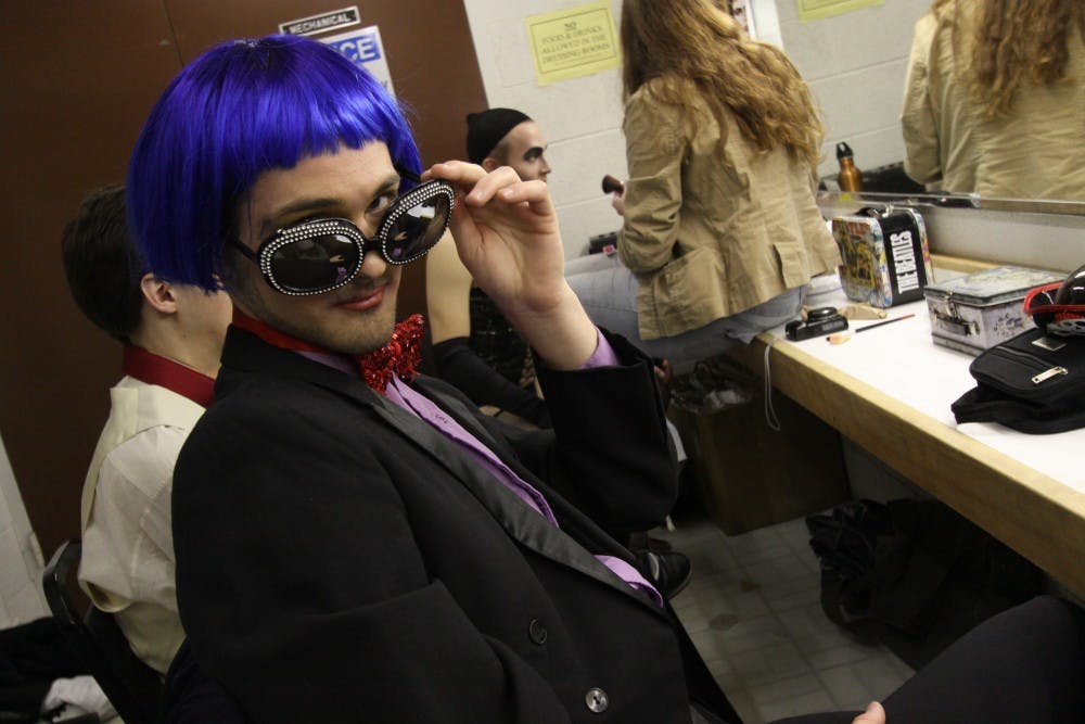 	Senior Tyler Knauf, who is a part of the chorus for “The Rocky Horror Show”, poses before dress rehearsal. The show opens this weekend and is the live stage version of the cult-classic film.
