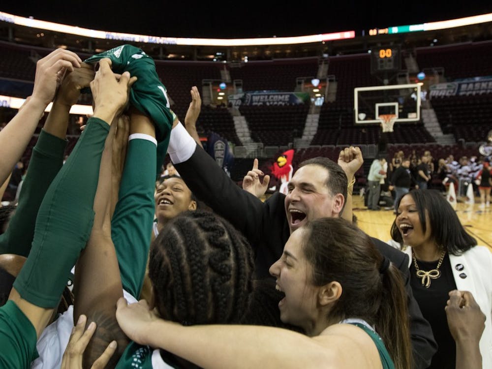 Eastern Michigan celebrates at mid-court in the Eagles 75-65 win over Ball State in the semi-finals of the MAC tournament in Cleveland. OH on March 13, 2015.