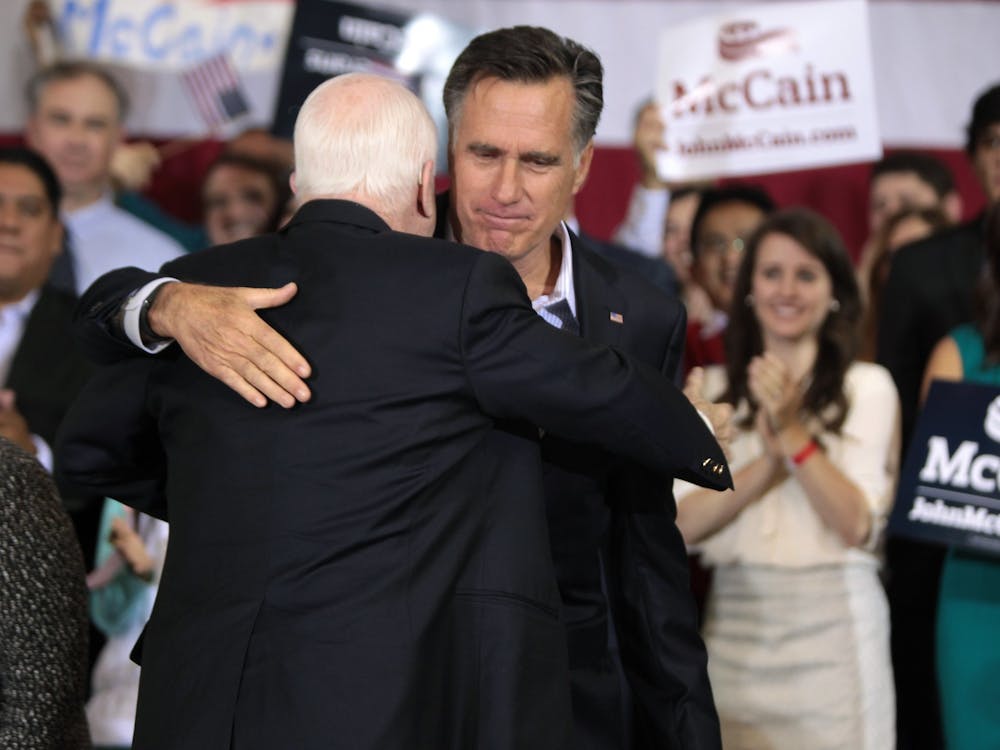 Mitt Romney hugs fellow former Republican presidential candidate John McCain back in 2015. After Romney&#x27;s historic vote to convict President Trump on an impeachment charge of abuse of power, many are drawing comparisons to himself and the late Senator.Photo by Gage Skidmore on Flickr.