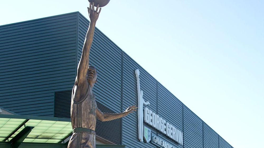 A bronze statue unveiled in August 2023 depicts EMU alum and NBA player George "Iceman" Gervin, stands outside the George Gervin GameAbove Center on the Eastern Michigan University campus.