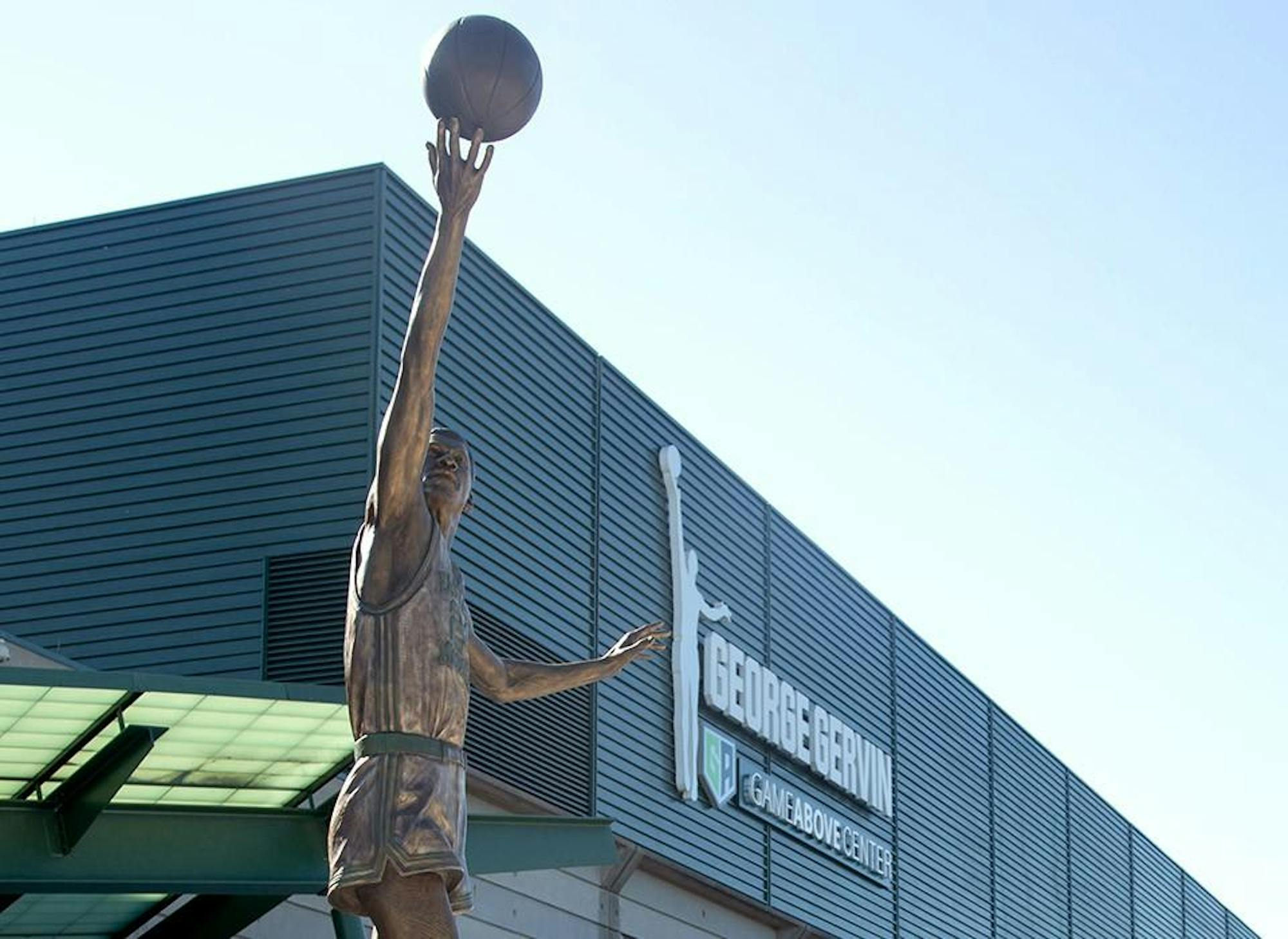 A bronze statue unveiled in August 2023 depicts EMU alum and NBA player George "Iceman" Gervin, stands outside the George Gervin GameAbove Center on the Eastern Michigan University campus. 