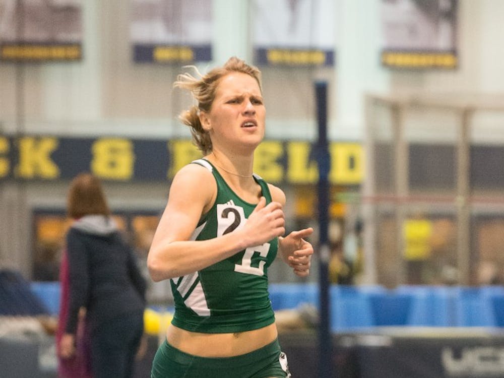 Eastern Michigan distance runner Victoria Voronko sprinting into the finish during the 3000m run on 18 January at the Simmons-Harvey Invitational in Ann Arbor.  She finished second with a time of 9:27.76.