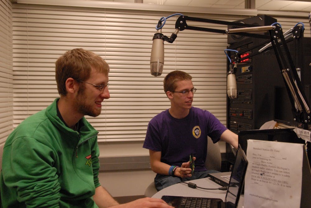 	Timothy Peruski and Anthony Papciak host “Schwing!” on Eagle Radio. The studio is located in Halle Library’s basement.