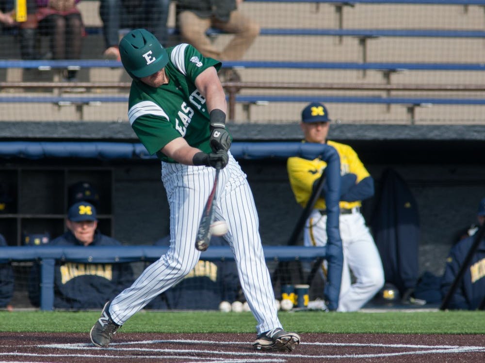 Eastern Michigan first baseman Lee Longo delivers one of his two hits in the Eagles 4-3 10th inning win over Michigan Wednesday afternoon in Ann Arbor.
