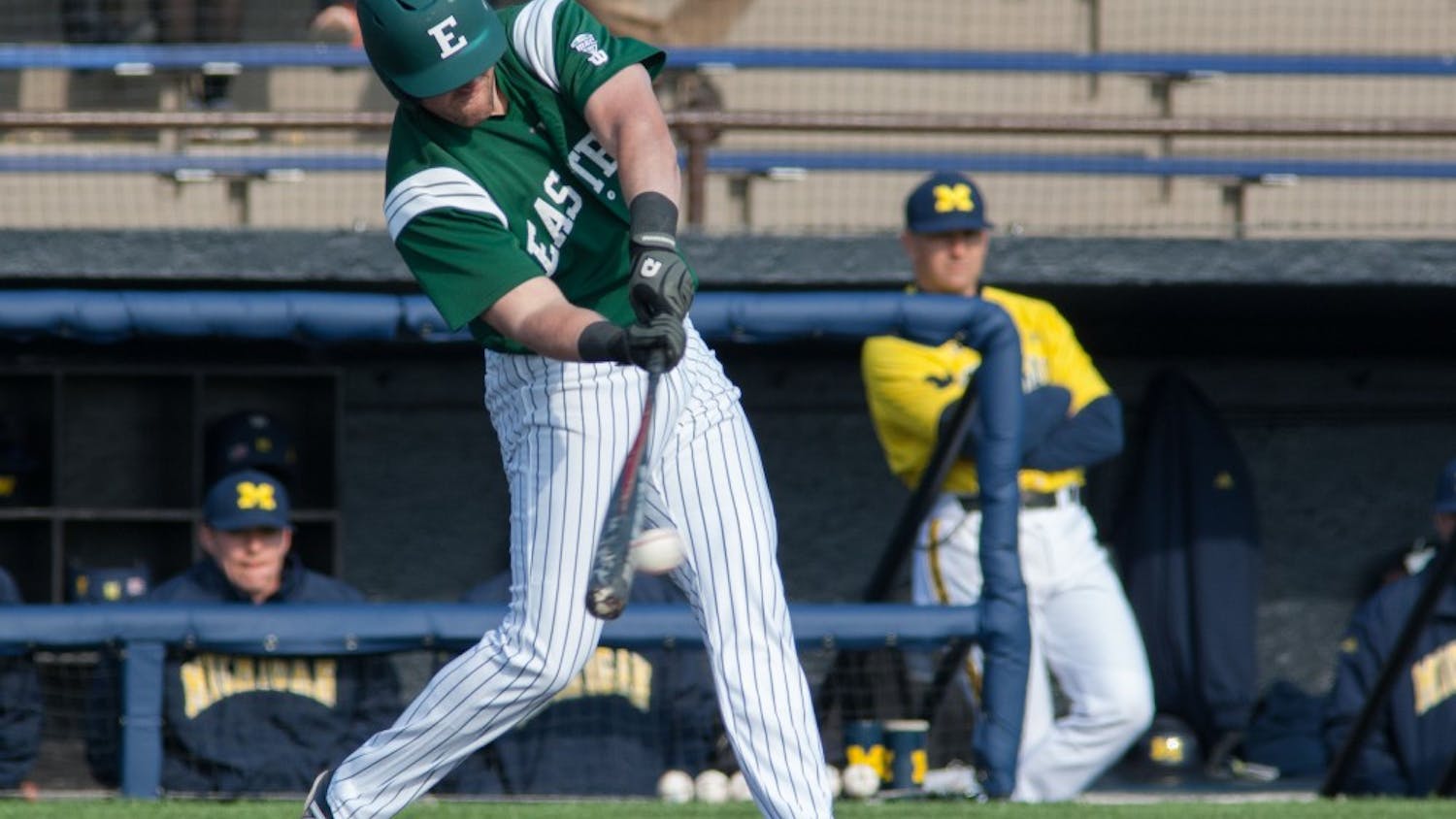 Eastern Michigan first baseman Lee Longo delivers one of his two hits in the Eagles 4-3 10th inning win over Michigan Wednesday afternoon in Ann Arbor.