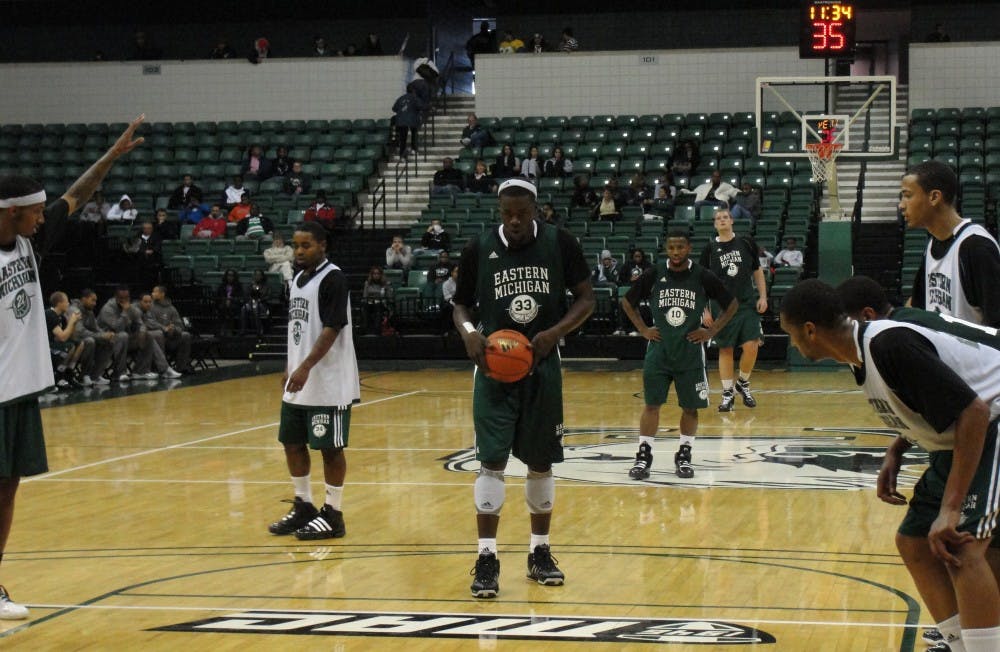 EMU men's basketball green and white