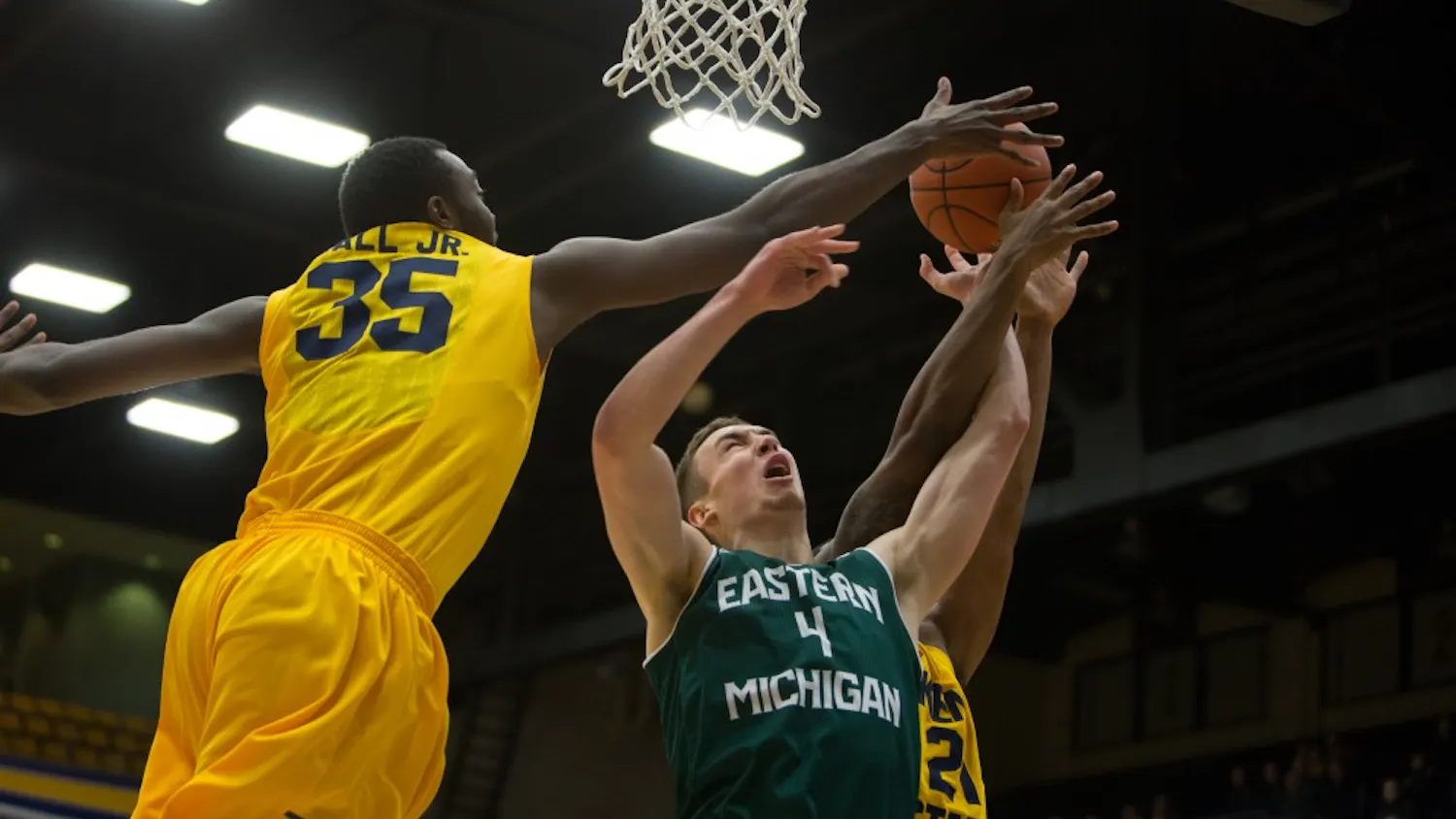 Eastern Michigan forward Brandon Nazione is blocked in the Eagles 65-59 loss to Kent State Wednesday night in Kent, OH.