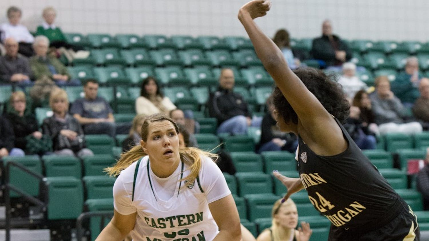 EMU forward Olivia Fouty (33) drives past WMU's Miracle Woods (24) in Eastern Michigan's 83-77 win over Western Michigan Wednesday night. Fouty had 14 points.
